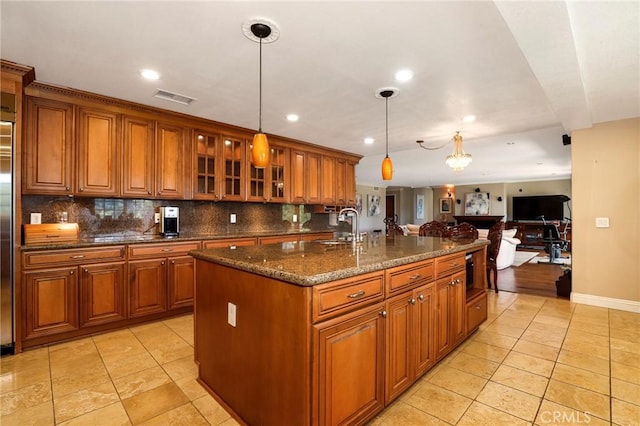 20454 Sartell Dr, Walnut, CA 91789 - kitchen featuring brown cabinets, light tile patterned flooring, visible vents, and a sink