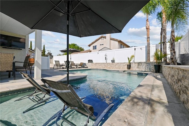 view of swimming pool with a patio, a fenced in pool, and a fenced backyard
