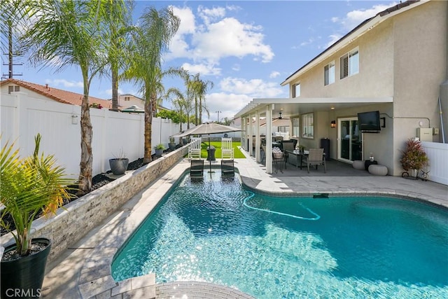 view of pool with a fenced backyard, a fenced in pool, a patio, and ceiling fan