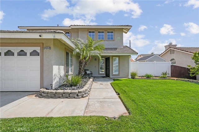 traditional-style home with stucco siding, a garage, a front lawn, and fence