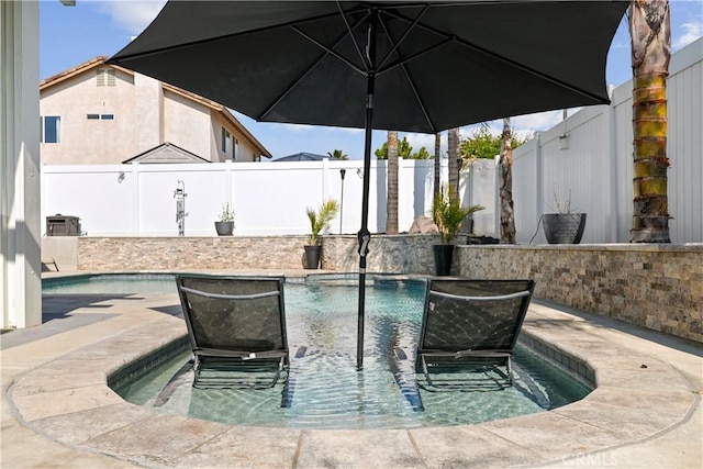 view of swimming pool with a fenced backyard and a fenced in pool