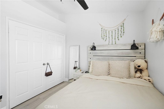 bedroom with a ceiling fan and wood finished floors