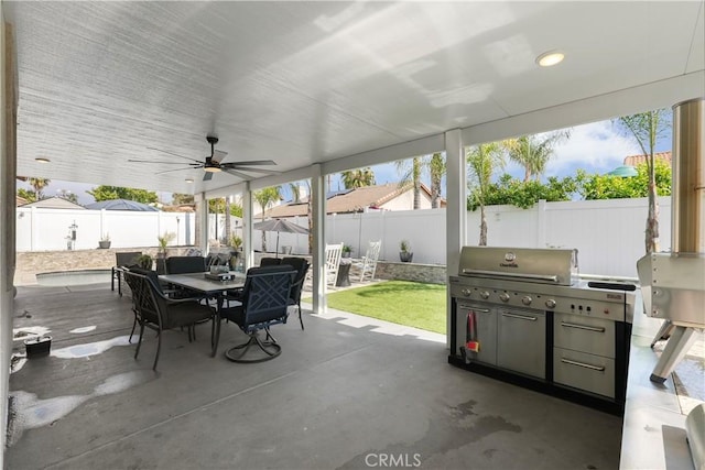 view of patio with a fenced backyard, ceiling fan, and outdoor dining space