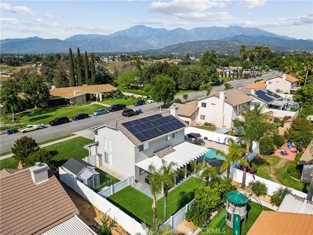 drone / aerial view with a residential view and a mountain view
