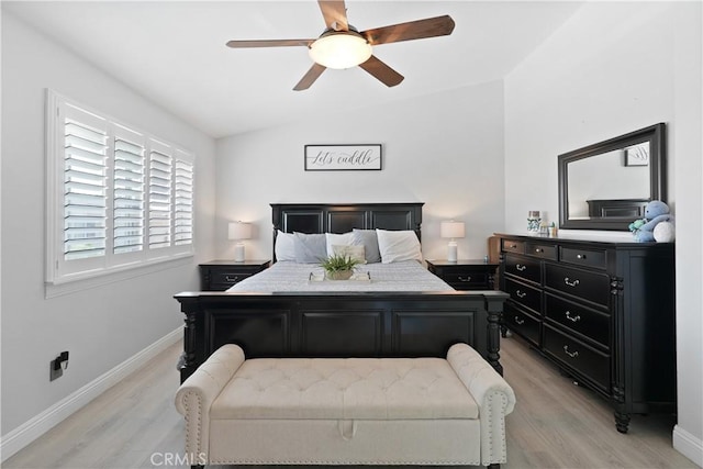bedroom featuring baseboards, ceiling fan, and light wood-style floors