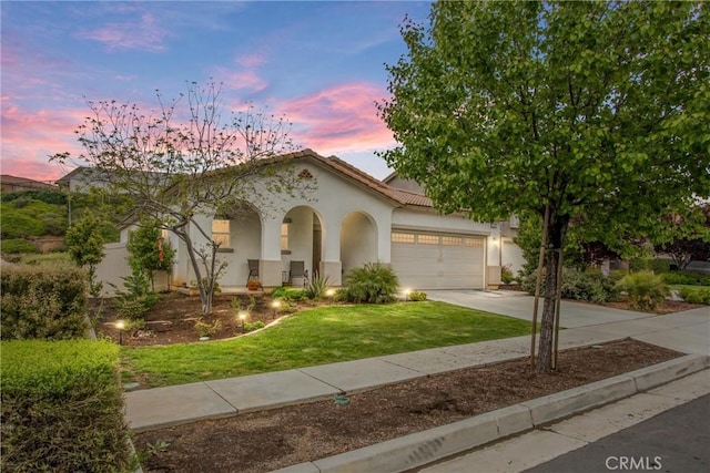 1229 Pinehurst Dr, Calimesa, CA 92320 - mediterranean / spanish home featuring stucco siding, a front yard, concrete driveway, a garage, and a tiled roof