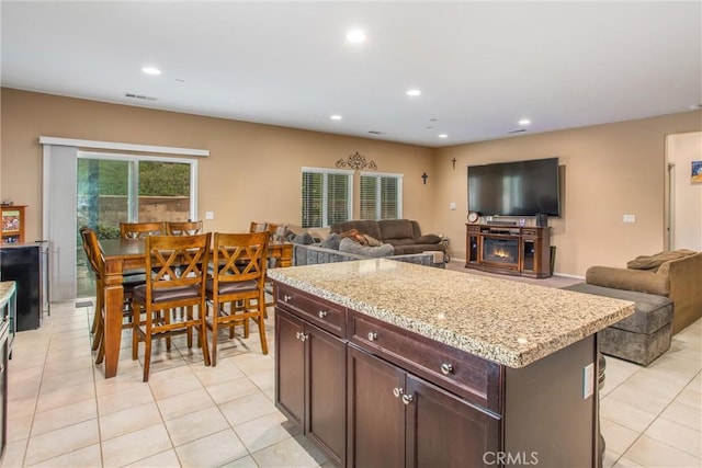 1229 Pinehurst Dr, Calimesa, CA 92320 - kitchen featuring open floor plan, light tile patterned flooring, recessed lighting, and light stone counters