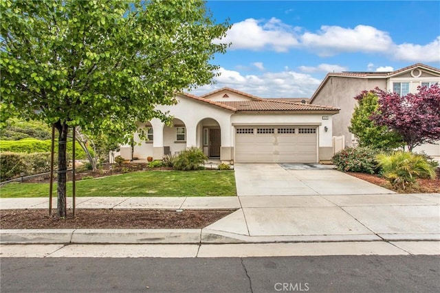 1229 Pinehurst Dr, Calimesa, CA 92320 - mediterranean / spanish home with an attached garage, stucco siding, driveway, and a front yard