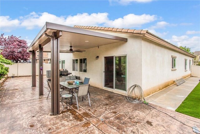 1229 Pinehurst Dr, Calimesa, CA 92320 - back of house with a ceiling fan, fence, a patio area, stucco siding, and a tile roof