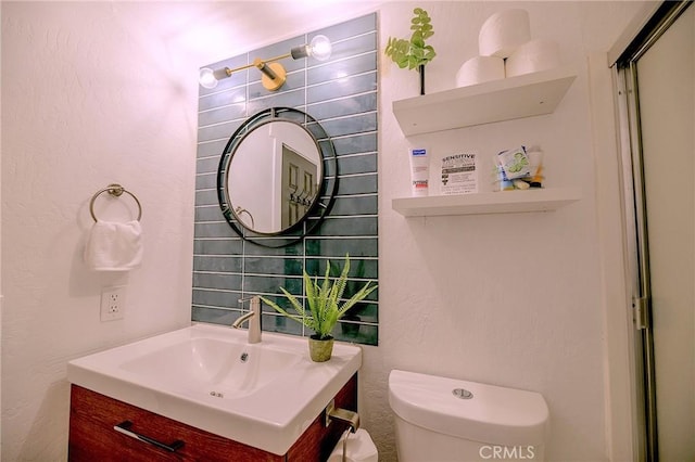 half bath with vanity and toilet