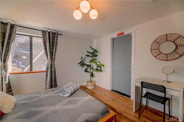 bedroom featuring wood finished floors