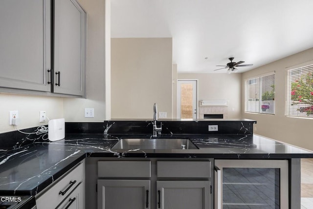 834 Corte Baya Vis, Oxnard, CA 93030 - kitchen featuring beverage cooler, gray cabinets, a sink, and a peninsula