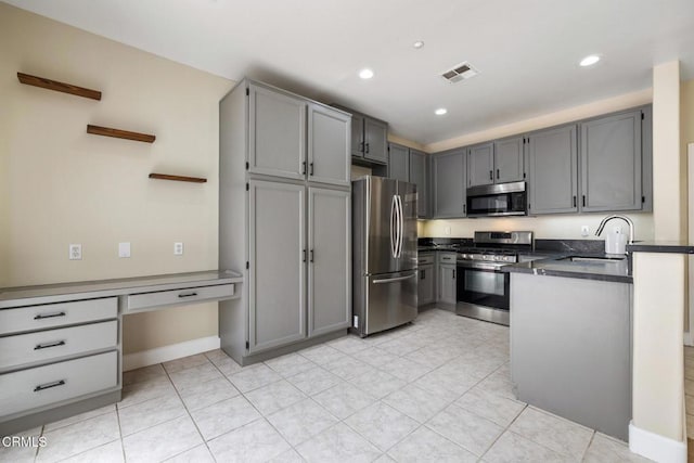 834 Corte Baya Vis, Oxnard, CA 93030 - kitchen with a sink, appliances with stainless steel finishes, gray cabinets, and dark countertops