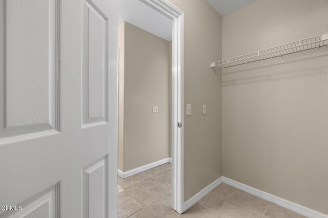 834 Corte Baya Vis, Oxnard, CA 93030 - clothes washing area featuring light tile patterned flooring and baseboards