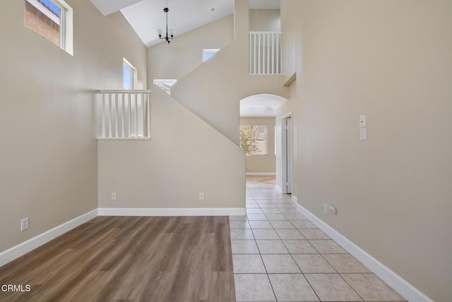 834 Corte Baya Vis, Oxnard, CA 93030 - interior space featuring arched walkways, baseboards, a wealth of natural light, and high vaulted ceiling