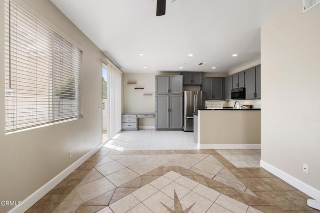 834 Corte Baya Vis, Oxnard, CA 93030 - kitchen with gray cabinets, freestanding refrigerator, recessed lighting, baseboards, and visible vents