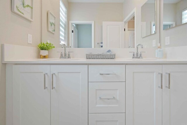 1662 Whitmore Loop, Chula Vista, CA 91913 - bathroom featuring double vanity, a sink, and a wealth of natural light