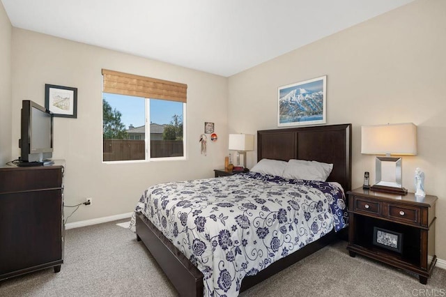 carpeted bedroom with baseboards