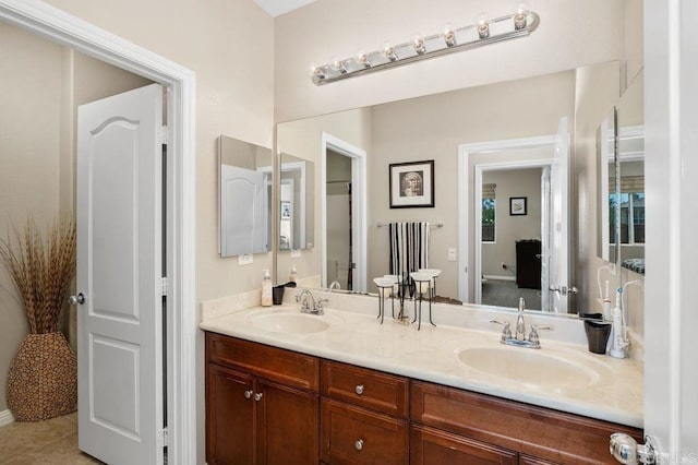 bathroom featuring double vanity and a sink