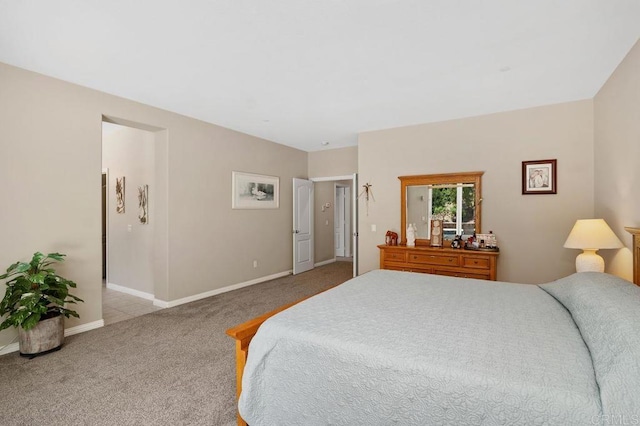 bedroom with baseboards and carpet flooring