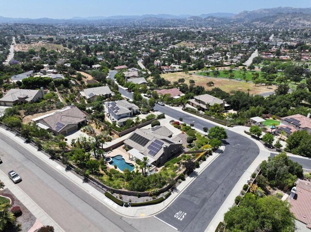 drone / aerial view featuring a mountain view and a residential view