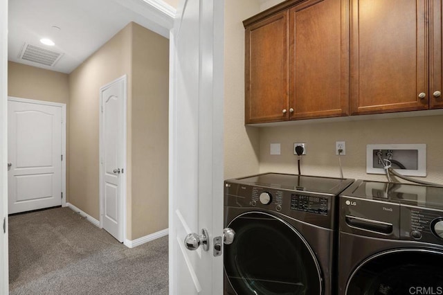 laundry room with visible vents, cabinet space, baseboards, separate washer and dryer, and carpet flooring