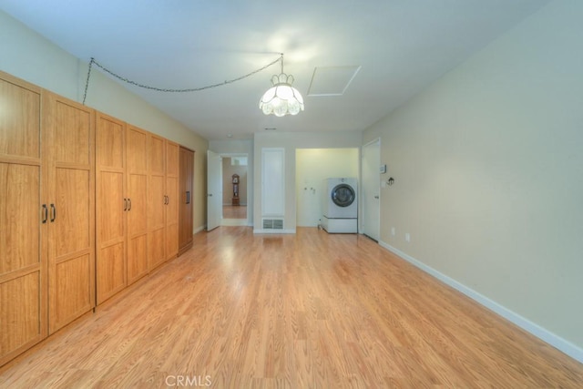 24731 Huntley Dr, Moreno Valley, CA 92557 - unfurnished bedroom featuring light wood-style floors, baseboards, washer / clothes dryer, and visible vents