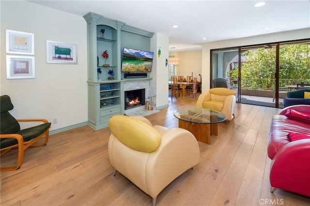 living room with recessed lighting and light wood finished floors
