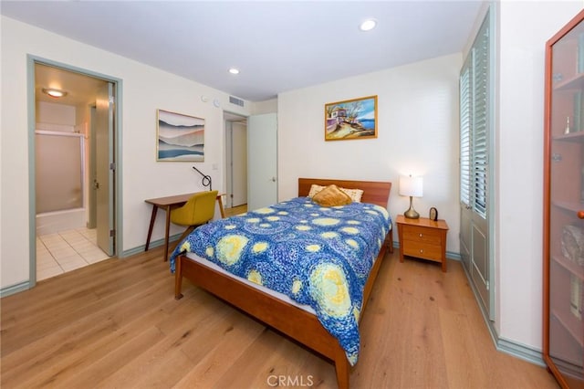 bedroom with visible vents, recessed lighting, light wood finished floors, and baseboards