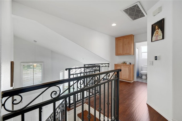 hall with a wealth of natural light, visible vents, recessed lighting, and an upstairs landing