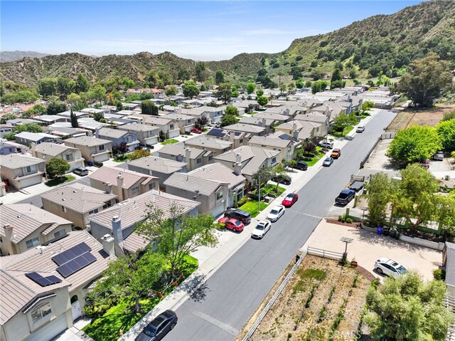 drone / aerial view featuring a residential view and a mountain view