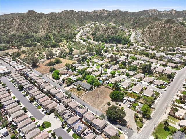 aerial view featuring a mountain view and a residential view