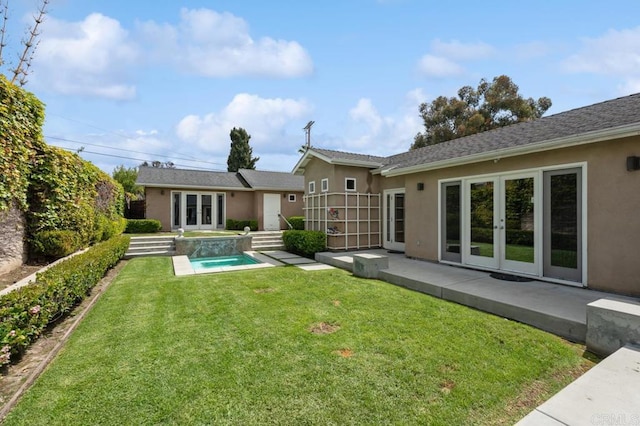 back of house featuring stucco siding, an outdoor pool, french doors, a patio, and a yard