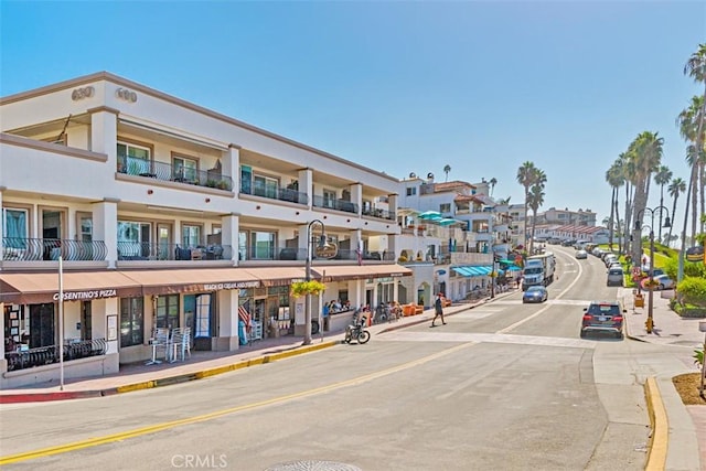 207 Via Galicia, San Clemente, CA 92672 - view of asphalt road with street lighting, curbs, sidewalks, and a residential view