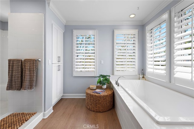 207 Via Galicia, San Clemente, CA 92672 - bathroom with wood finished floors, crown molding, a bath, baseboards, and tiled shower