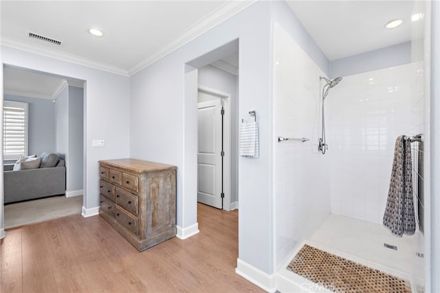 207 Via Galicia, San Clemente, CA 92672 - full bathroom with wood finished floors, a tile shower, recessed lighting, and ornamental molding