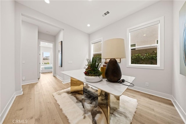 office space with visible vents, recessed lighting, baseboards, and light wood-type flooring