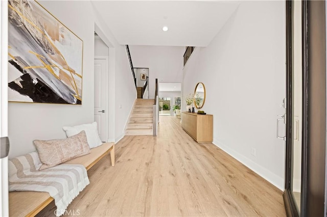 271 Huckleberry, Lake Forest, CA 92630 - hall with light wood-style flooring, stairs, baseboards, and recessed lighting
