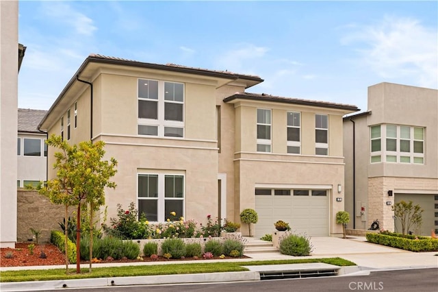 271 Huckleberry, Lake Forest, CA 92630 - view of front of house with an attached garage, stucco siding, and driveway