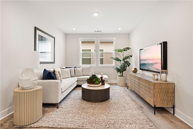 271 Huckleberry, Lake Forest, CA 92630 - living area with baseboards, recessed lighting, visible vents, and wood finished floors