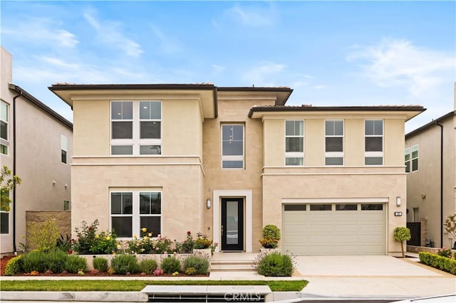 271 Huckleberry, Lake Forest, CA 92630 - view of front of property with a garage, stucco siding, and driveway