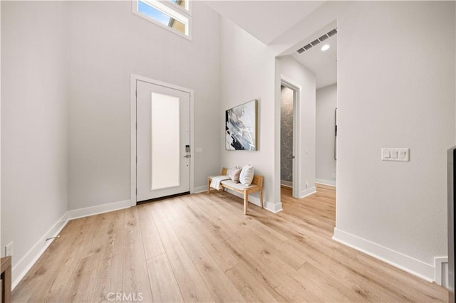 271 Huckleberry, Lake Forest, CA 92630 - foyer entrance featuring baseboards, light wood-style floors, visible vents, and a high ceiling