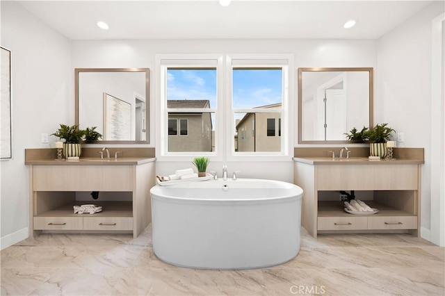 271 Huckleberry, Lake Forest, CA 92630 - full bath with a soaking tub, marble finish floor, two vanities, and a sink