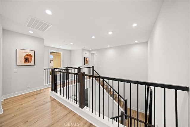 271 Huckleberry, Lake Forest, CA 92630 - hallway with wood finished floors, an upstairs landing, visible vents, recessed lighting, and baseboards