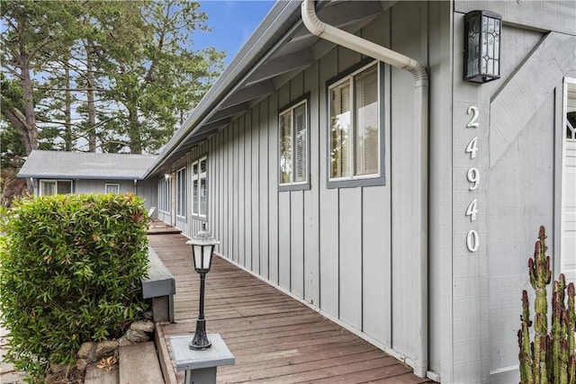 view of property exterior featuring a wooden deck and board and batten siding