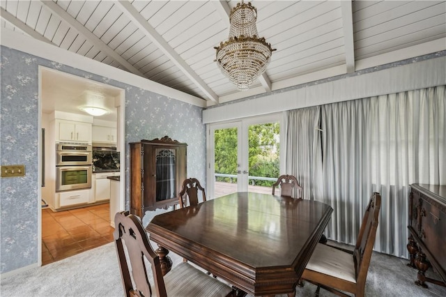 dining room with vaulted ceiling with beams, wallpapered walls, a chandelier, and french doors