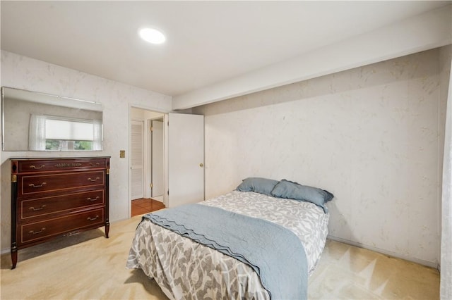 bedroom featuring light colored carpet