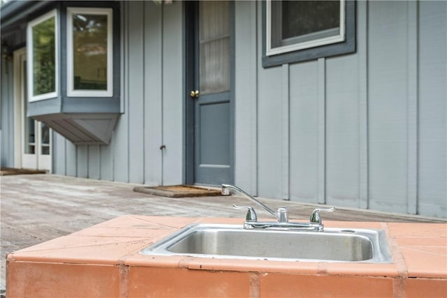 24940 Outlook Dr, Carmel, CA 93923 - doorway to property featuring board and batten siding, a sink, and a hot tub