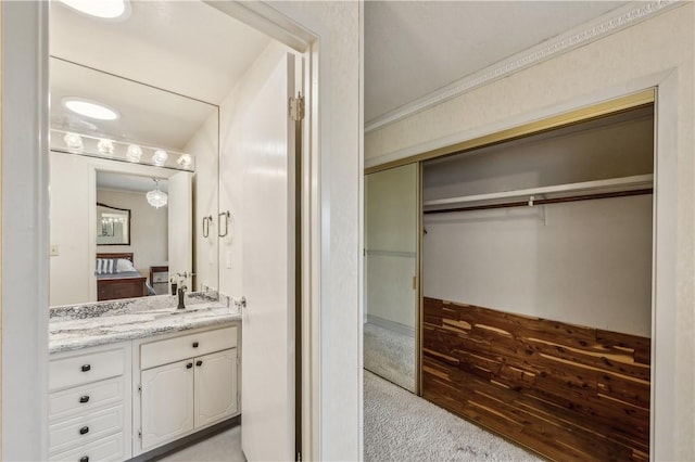 bathroom with ensuite bathroom and vanity
