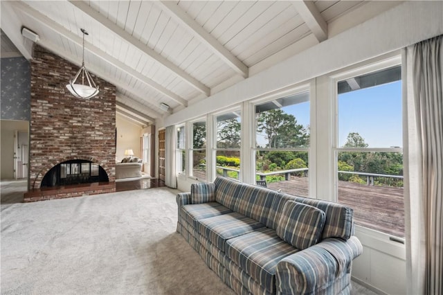 sunroom with high vaulted ceiling, beamed ceiling, and carpet flooring